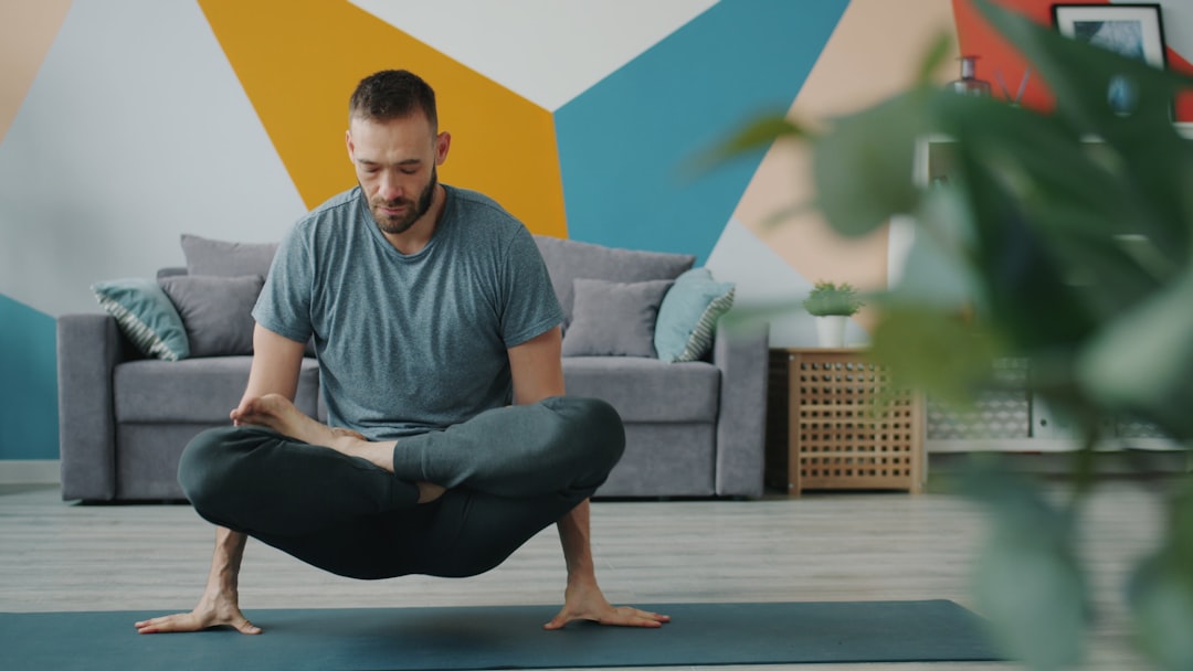 Man over 40 doing home workout with bodyweight exercises